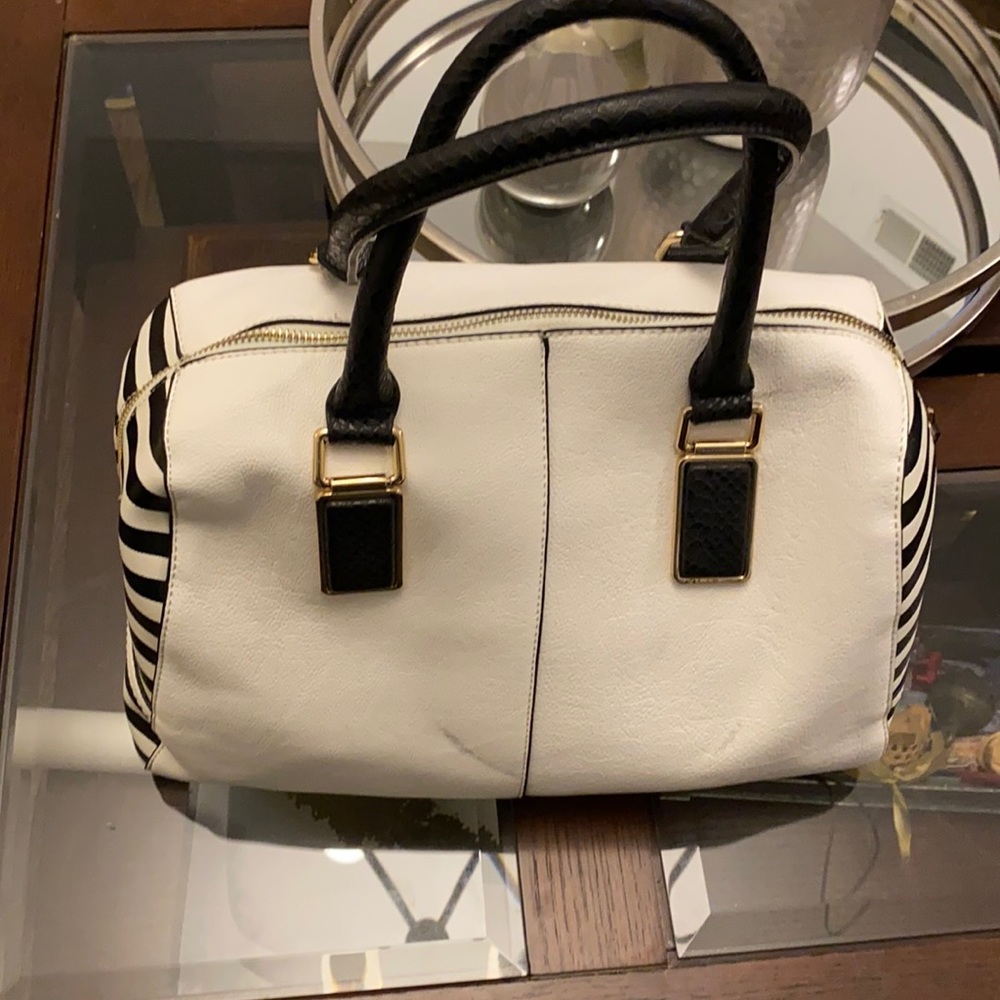 Faux leather back and white purse with gold hardware